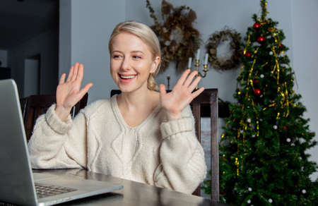 woman working with laptop at home office during pandemic