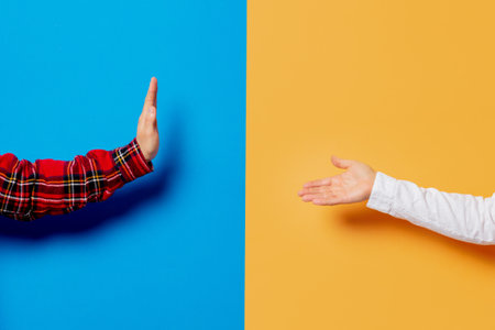 two hands, one showing acceptance, the other refusingの写真素材