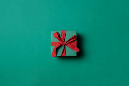 Holiday gift box on Paolo Veronese Green color background. Above viewの写真素材