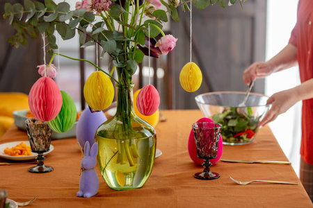 woman sets the Easter table. for dinner. True lifestyleの写真素材