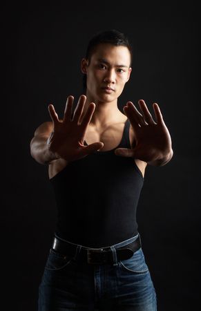 Great looking asian guy shot in studio - tough poseの写真素材