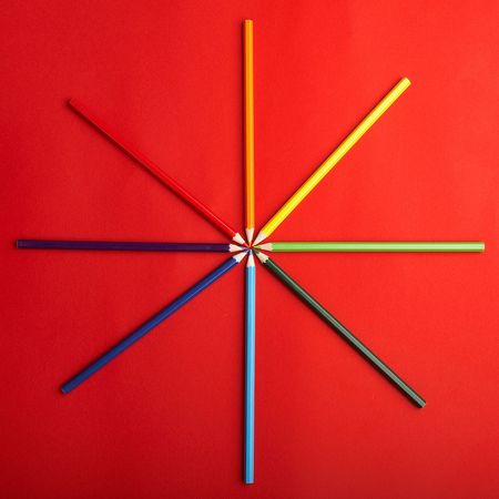 A Circle of Colored Pencils on Red Background - check my gallery for more picturesの写真素材