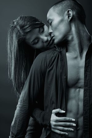 Fashion Couple Dramatic image shot in studioの写真素材