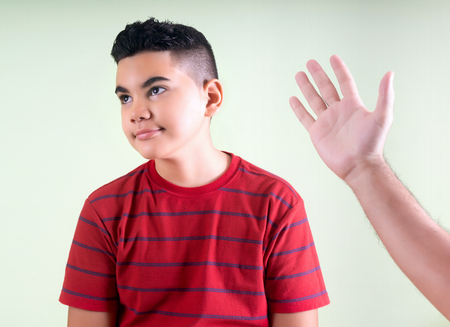 Naughty boy threatened by his fatherの写真素材