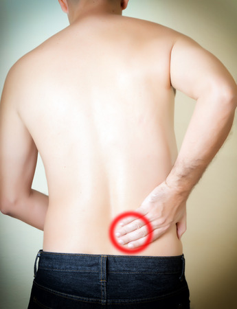 young man with a lumbar painの写真素材