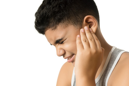 Boy has earache isolated on whiteの写真素材