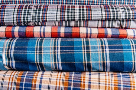 Different types of fabrics lie on each otherの写真素材