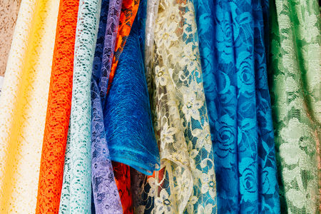 Different types of fabrics are stacked in a rowの写真素材