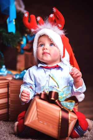 The child was presented with a gift for Christmasの写真素材