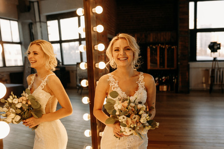 Beautiful bride is very emotional and laughsの写真素材