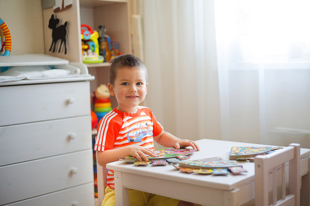 Little boy loves to read different storiesの写真素材