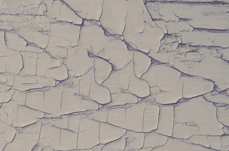 Cracked gray paint from time to timeの写真素材