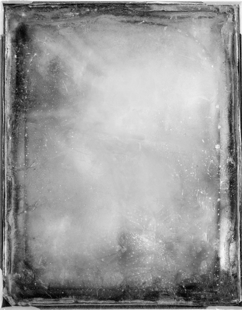 Black and white frame with scratches and damages.Texture or background.の写真素材