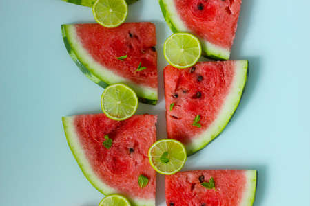 Lime slices with mint and slices of ripe watermelonの写真素材