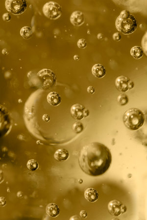 Bubbles in a plastic form of golden color close-up
