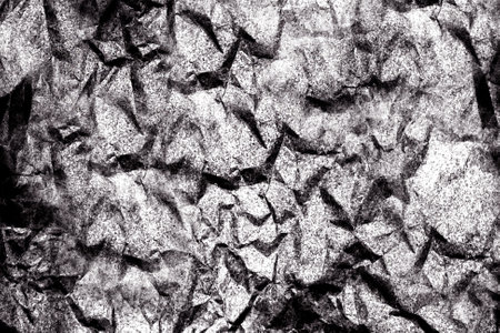 Abstract grey surface with uneven sharp angular rough surfaceの写真素材