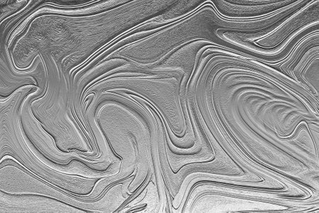 Rough grey background with wavy abstract patternの写真素材