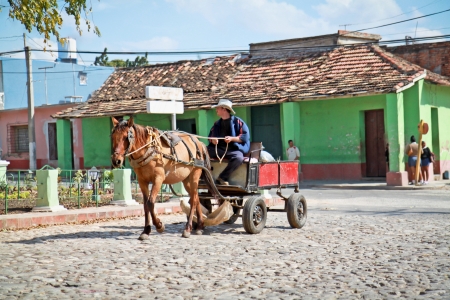 TRINIDAD, CUBA-JANUARY 13:Unidentified farmer driving rustic carriage with one horse in Trinidad on January 13. 2010. , Cuba.Cuba has very expensive petrol cause many farmers used carriage for travelのeditorial素材
