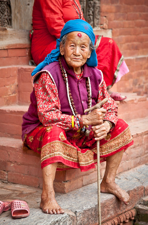KATHMANDU, NEPAL - MAY 18 - Old woman sit in the retirement home founded by Mother Teresa in 
Rajrajeshwari Temple near Pashupatinath Temple, Kathmandu, Nepal on May 18, 2013のeditorial素材