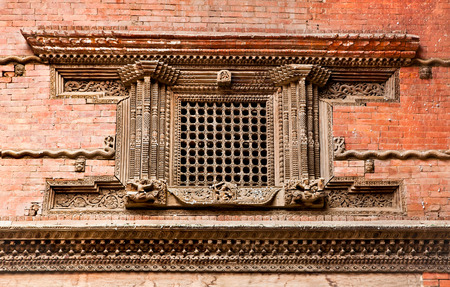 Carved wooden window on Hanuman Dhoka old Royal Palace, Durbar Square in Kathmandu,  Nepal.の写真素材