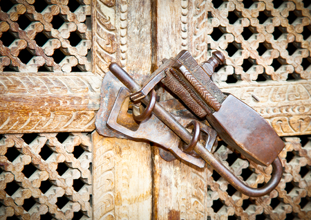 Ornament vintage metal lock on wooden door, Kathmandu.Nepal.の写真素材
