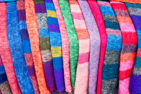 Pile of gentle folded shawls (scarfs) at the market, Pokhara, Nepal.の写真素材
