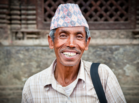 KATHMANDU, NEPAL - MAY 20 - Portrait of  an unidentified man next to to his ear living in Bhaktapur, the most beautiful city within the Kathmandu Valley, on May 20, 2013, Nepalのeditorial素材