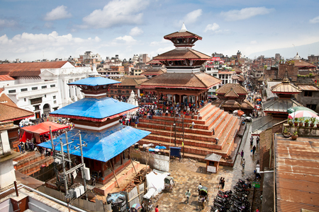 KATHMANDU, NEPAL-MAY 18: Crowd of local Nepalese people visit the famous Durbar square on May 18, 2013 in Kathmandu, Nepal. Bhaktapur is the third largest city in Kathmandu valleyのeditorial素材