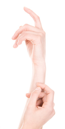 Woman is showing a sign with his hands on a white backgroundの写真素材