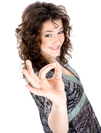 Beautiful brunette  show singh with fingersの写真素材