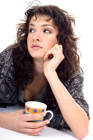 portrait of a beautiful young woman  holding coffee cupの写真素材