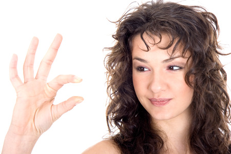 Beautiful brunette  show sign with fingersの写真素材