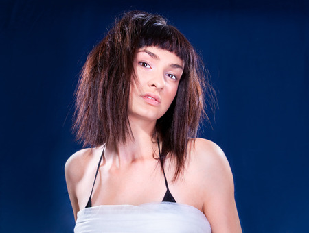 Beautiful young  brunette posing , studio shotの写真素材