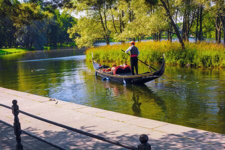 ST. PETERSBURG, RUSSIA - July 30, 2012. A trip around the Great Pond in Tsarskoe Selo in summer on a gondola is a traditional Venetian entertainment, transferred to Pushkin, St. Petersburg,のeditorial素材