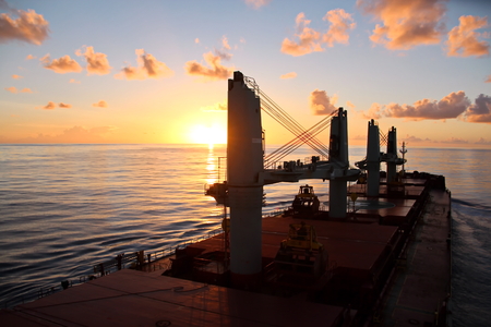 Sunset in the Pacific Ocean. Different types of sunset from the side of the ship while driving and anchoring at the port. Riot of colors of the ocean, clouds and sun.の写真素材