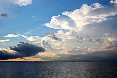 Sunset in the Pacific Ocean. Different types of sunset from the side of the ship while driving and anchoring at the port. Riot of colors of the ocean, clouds and sun.の写真素材