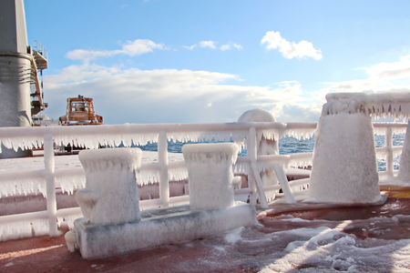 Ice of the ship and ship structures after sailing in frosty weather. Ice patterns and icicles, the...