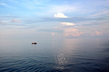 Seascapes. Various kinds of colorful blue sky, sun, clouds and open spaces of the world ocean. View from the side of the sea ship while moving and in the port at anchor.の写真素材