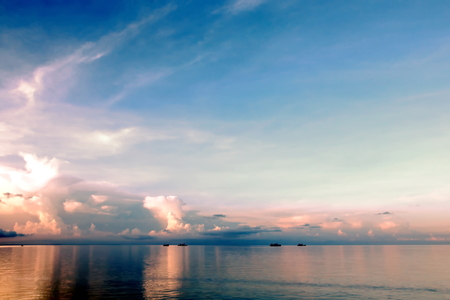 Seascapes. Various kinds of colorful blue sky, sun, clouds and open spaces of the world ocean. View from the side of the sea ship while moving and in the port at anchor.の写真素材