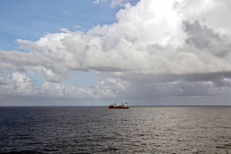 Seascapes. Various kinds of colorful blue sky, sun, clouds and open spaces of the world ocean. View from the side of the sea ship while moving and in the port at anchor.の写真素材