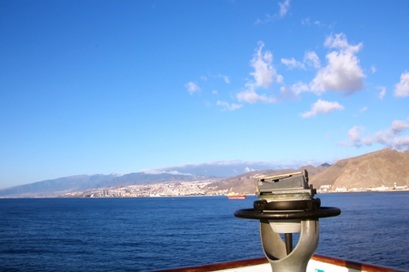 Colorful view of the coast of the Canary Islands and the port of Las Palmas against the blue sky and clouds from the side of the sea ship anchored. February, 2012.の写真素材