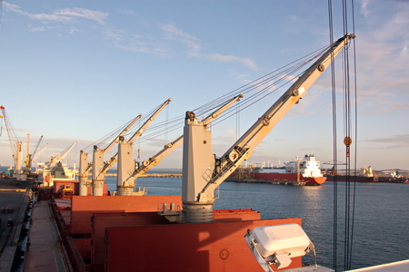 Transshipment terminal for loading steel products to sea vessels using shore cranes and special...