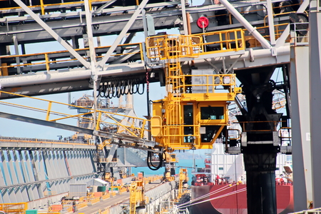 Loading terminal of coal products for cargo ships, bulkers and view of the cargo cranes loader and...