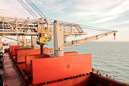 Loading terminal of coal products for cargo ships, bulkers and view of the cargo cranes loader and ships alongside of pier. Hay Point, Australia, February, 2018.の写真素材