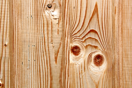 Wooden boards close-up with a view of the structure of the tree and knotsの写真素材