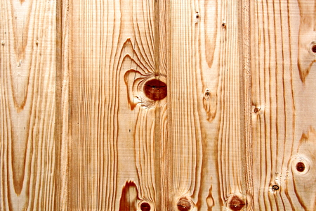 Wooden boards close-up with a view of the structure of the tree and knotsの写真素材