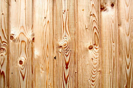 Wooden boards close-up with a view of the structure of the tree and knotsの写真素材