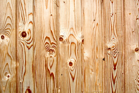 Wooden boards close-up with a view of the structure of the tree and knotsの写真素材