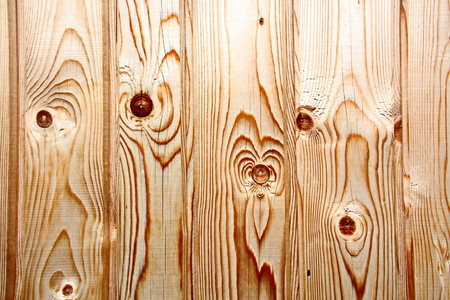 Wooden boards close-up with a view of the structure of the tree and knotsの写真素材