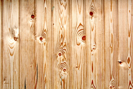 Wooden boards close-up with a view of the structure of the tree and knotsの写真素材
